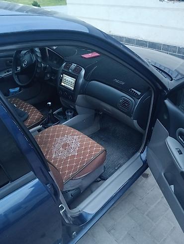 пороги демио: Mazda Familia: 2002 г., Механика, Универсал — 4