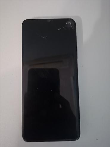 note 50 pro: Mavi rəngdə, böyük ekranlı smartfon. Cihazın ön hissəsində damla — 3