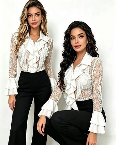 elastin poliamid: Ženska elegantna čipkana bluza sa volanima

Kosulja: 2.700 dinara — 2
