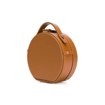 удобная сумка: Мини сумка коричневая Форма круг, застежка кнопка. Есть два ремня