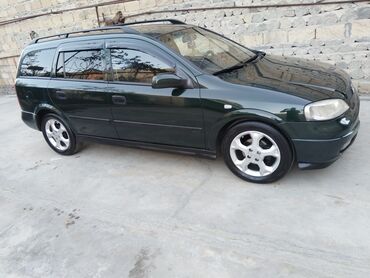 Opel: Opel Astra Caravan (universal) – tünd yaşıl rəng • Kuzov: universal — 2