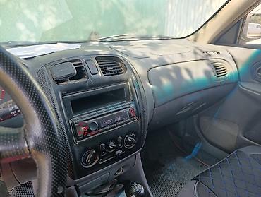 мазда 323 фк: Mazda 323: 1998 г., Хэтчбэк — 7