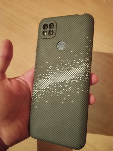 камера на телефон: Смартфон Xiaomi Redmi 9 в черном цвете с текстурированным чехлом