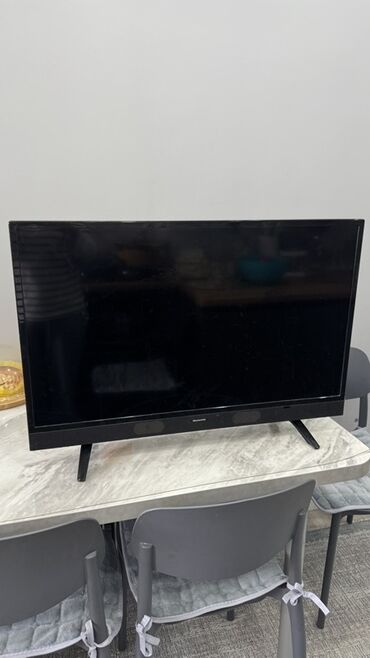 планшет cube t970: Телевизор (Skyworth) с плоским экраном, диагональ примерно 32–40"