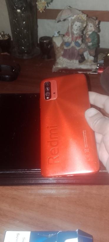 xiaomi pad: Məhsul: Xiaomi Redmi smartfon (qırmızı korpus) Xüsusiyyətlər: - Arxa — 2