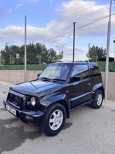 тоя пистолет: Mitsubishi Pajero Junior: 1998 г., 1.1 л, Автомат, Бензин, Внедорожник — 2