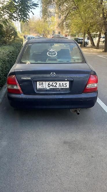 ua 705: Mazda Familia: 2002 г., Автомат, Бензин, Седан — 3