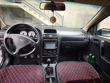 Opel: Opel Astra Caravan (universal) – gümüş rəngli kuzov, 5 qapı, dam — 1