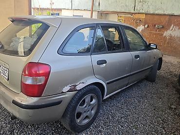 m5 e60 v10: Mazda 323: 2000 г., 1.6 л, Автомат, Бензин, Хэтчбэк — 7