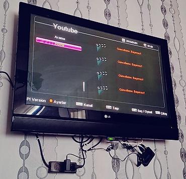 wifi adapteri: LG divar tipli televizor + Yupiter TV qutusu (IP/OTT set-top box) — 1
