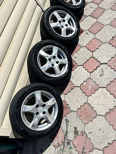 q 7: Комплект из 4 легкосплавных дисков Honda фит с шинами. Размер 14 — 2
