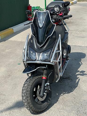 super soco: Скутер 50–150 см³ (визуально — максискутер форм-фактора “ADV”) с — 1