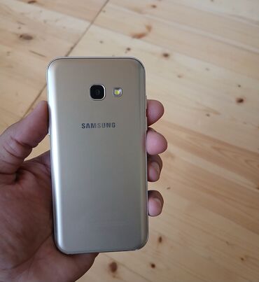 ucuz telefonlar samsung: Samsung Galaxy A3 2017, 4 ГБ, цвет - Золотой, Две SIM карты