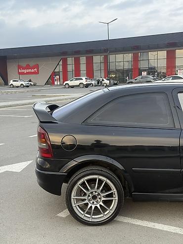 Opel: Model: Opel Astra G Coupe (3 qapı) Rəng: qara Kuzov: hetçbek/kupeli 3 — 3