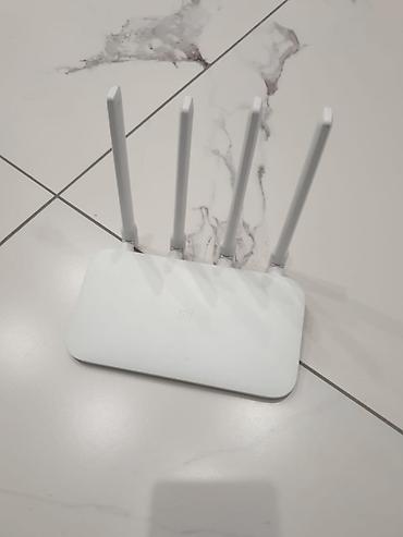 Модемы и сетевое оборудование: Xiaomi Mi Router 4C (R4CM) Продаю Wi-Fi роутер Xiaomi Mi Router 4C — 1