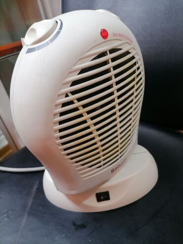 Kaloriferi: Grejalica duvaljka 2 brzine plus ventilator Saturn 2000w Okreće pri — 3