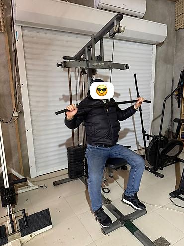 Çoxfunksiyalı gym trenajoru – kabel sistemli, oturacaqlı və ağırlıq