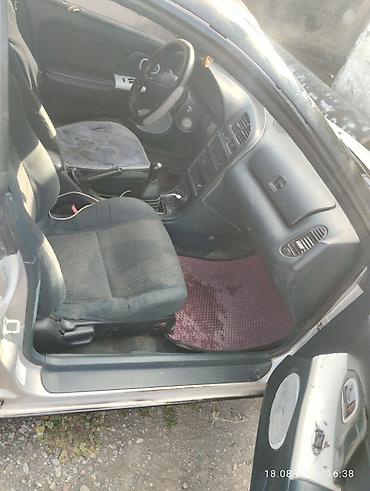 Mazda 323: 1996 г., 1.5 л, Механика, Бензин, Лифтбек — 6