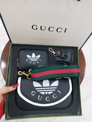 Çantalar: Gucci canta.Icerisinde cuzdan ve brulokda var.Yenidir satis ucun