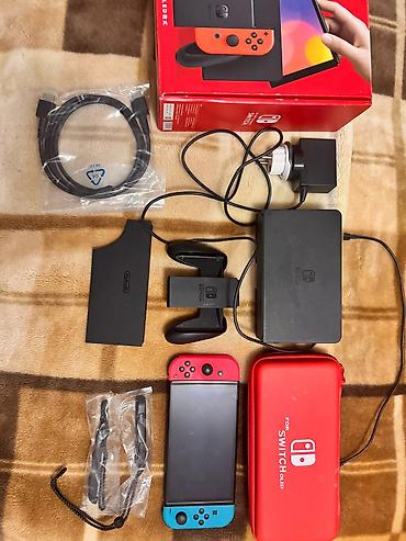 nintendo da: Nintendo Switch (OLED model) oyun konsolu – neon qırmızı və neon mavi — 3