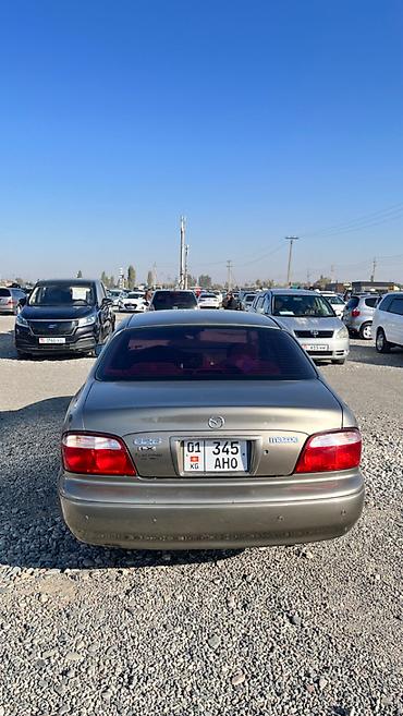 футляр для кия: Mazda Capella: 2001 г., 2 л, Автомат, Бензин, Седан — 6