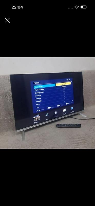 tankda bir tv almaq: Televizor, nazik çərçivəli və müasir dizayna malik modeldir. Şəkildə — 1
