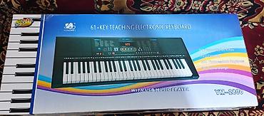 elektro gitarlar: YONGMEI YM-2800 – 61 düyməli elektron sintezator Xüsusiyyətlər: - 61 — 4