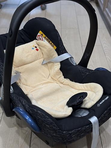 детские автокресла от 0 до 36 кг: Детское автокресло-переноска Maxi-Cosi (группа 0+) - Установка против — 3