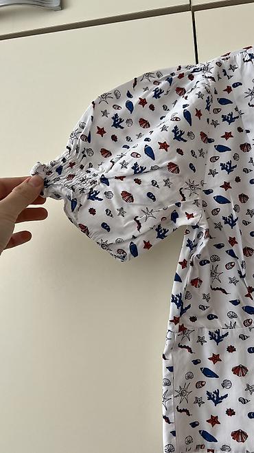 Ziyafət donları: - Məhsul: Oversize T‑shirt - Brend/Qrafika: “NEW ERA” mövzulu çap; ön — 16