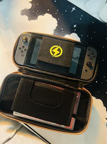 Nintendo Switch: Nintendo Switch (модель с док-станцией) Комплектация: - консоль — 10