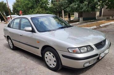 ауди 100 салон: Mazda 626: 1998 г., 1.8 л, Механика, Бензин, Хетчбек