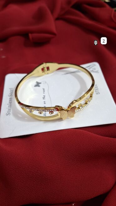 Bilərziklər: Qızılı rəngli, paslanmayan poladdan (STEEL) bəzək bilərziyi. Oval -da lalafo.az — 25 Bilərziklər: Qızılı rəngli, paslanmayan poladdan (STEEL) bəzək bilərziyi. Oval — 25