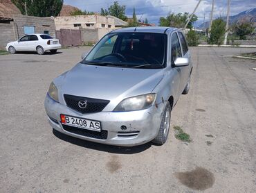 Mazda: Mazda Demio: 2002 г., 1.3 л, Механика, Бензин, Седан