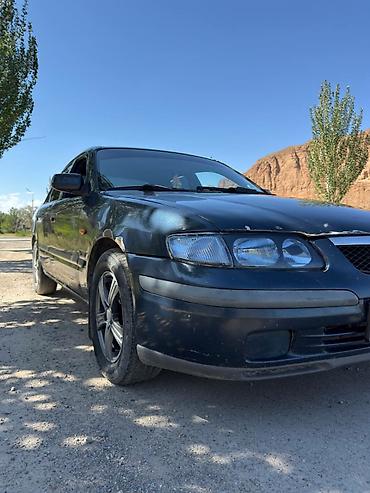385 55: Mazda 626: 1997 г., 1.8 л, Механика, Газ, Седан — 6