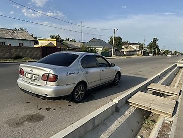 керме тоо: Nissan Primera: 1999 г., Кол менен иштөөчү, Бензин, Седан — 3
