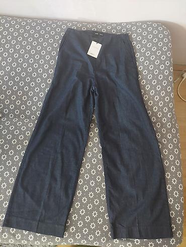 yassa jakne: MANGO ženske pantalone od tamnog denima, širokog kroja.Velicina M - — 2