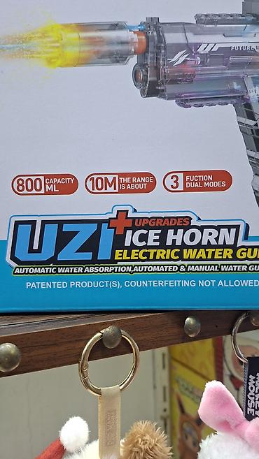 inkişaf etdirici oyuncaqlar: ● Bu, "Uzi Ice Horn" modeli olan elektrikli su tapançasıdır ● Tapança — 9