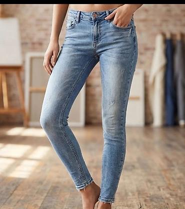 Ženske skinny farmerke – svetlo plave isprane - Kroj: skinny/uz nogu
