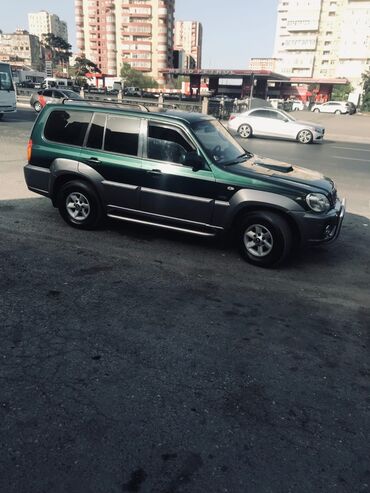 диски на авто bbs: Tünd yaşıl və boz rəngdə olan Hyundai Terracan avtomobili. Avtomobilin