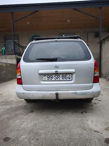 Opel: Opel Astra Caravan (universal) – gümüş rəngli kuzov, 5 qapı, dam — 10