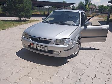 a8 d2: Mazda Familia: 1999 г., 1.6 л, Механика, Бензин, Универсал — 6