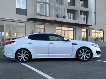 Kia: Kia Optima – ağ rəngli, zərif sedan Xarici xüsusiyyətlər: - Aqressiv — 2