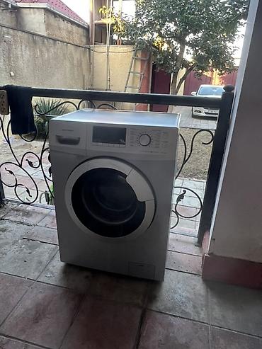 Hoffmann önyükləməli paltaryuyan maşın - Gümüşü rəng, ön paneldə LCD