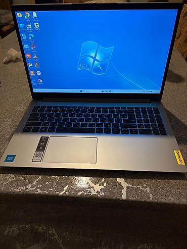 lenovo log: Lenovo noutbuku – gümüşü rəngdə, nazik korpuslu, 15.6" ekranlı model — 4