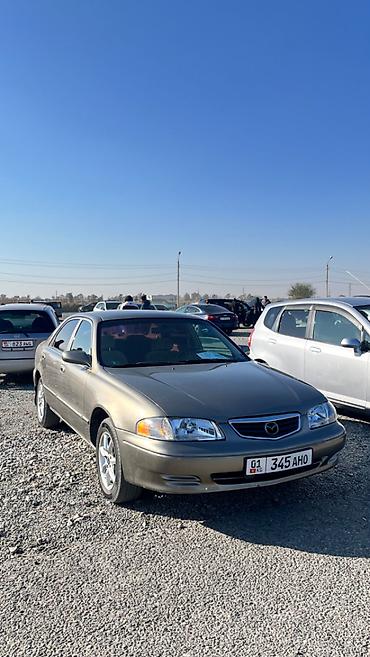 футляр для кия: Mazda Capella: 2001 г., 2 л, Автомат, Бензин, Седан — 3