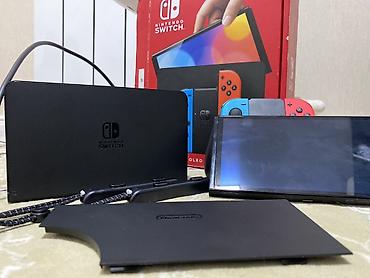 Nintendo Switch OLED (неоновые Joy‑Con) Комплектация: - Консоль