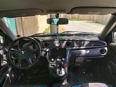 pro scooter: Mitsubishi (Airtrek/Outlander ilk nəsil) krossover, ağ rəng. Xarici — 3