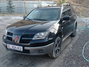 аутлендер оутлендер аиртрек айртрек: Mitsubishi Outlander I (рестайлинг), черный кроссовер с серебристыми