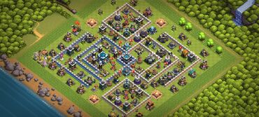 Oyun diskləri və kartricləri: Bu, Clash of Clans oyununda balanslı bir kənd təsviridir. Müdafiə