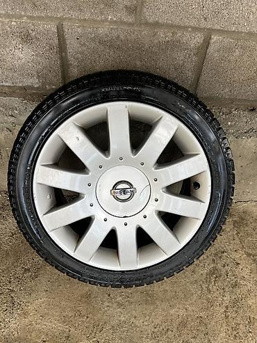 e34 4 4: Оригинальное колесо Nissan в сборе: - Литой диск Nissan, 10‑спицевый — 1